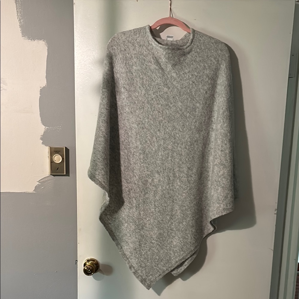 Grey poncho, stretchy.